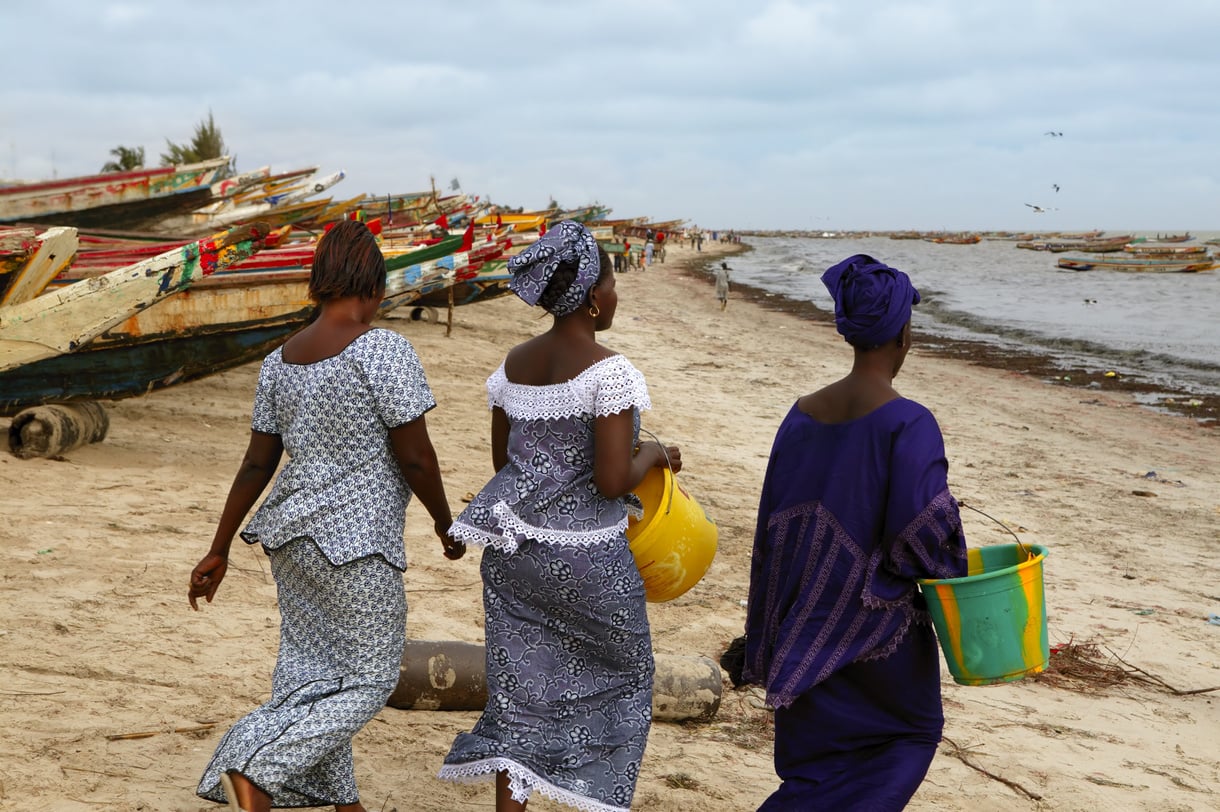 Three Women Walking Beach in Africa Senegal